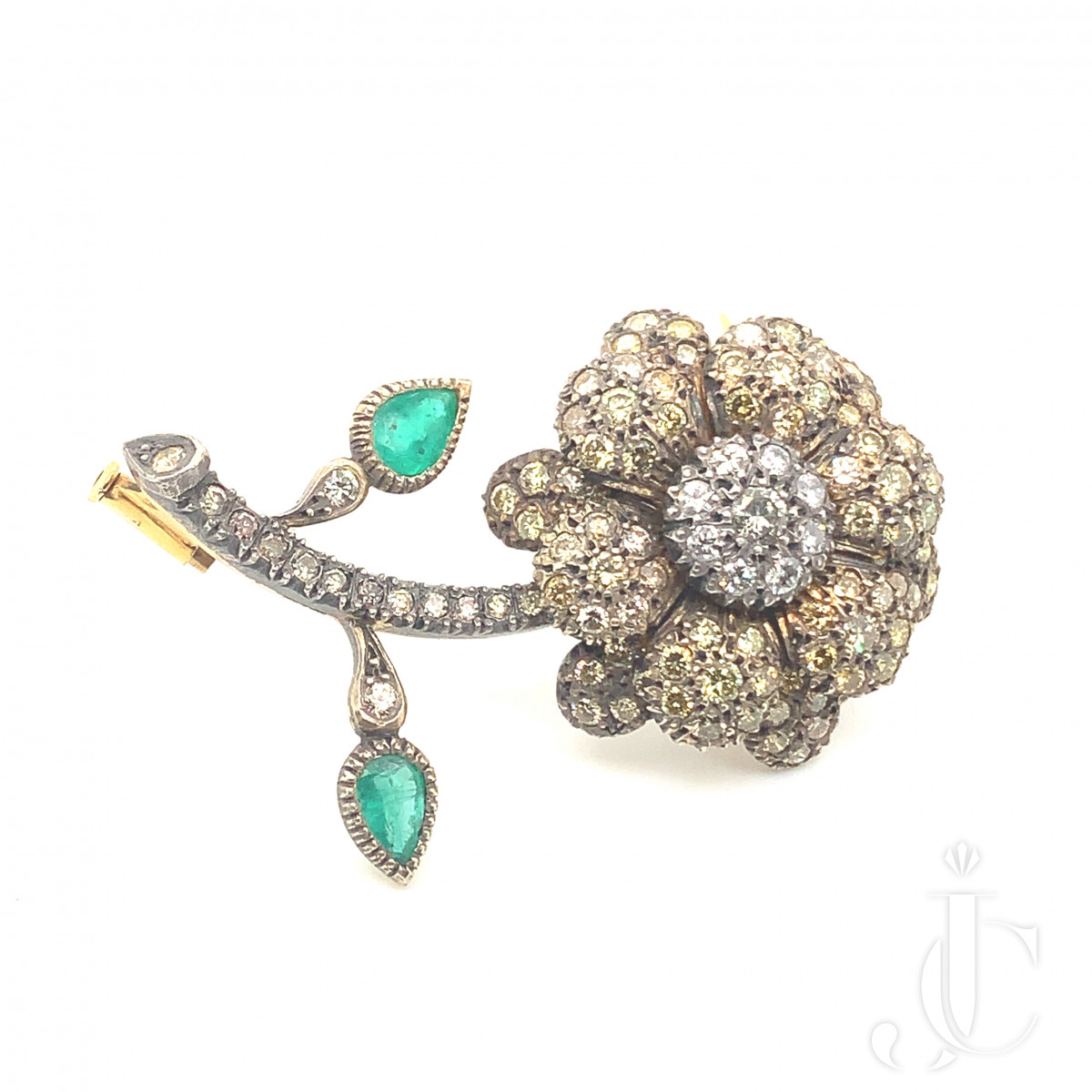 Floral form emerald & diamond brooch